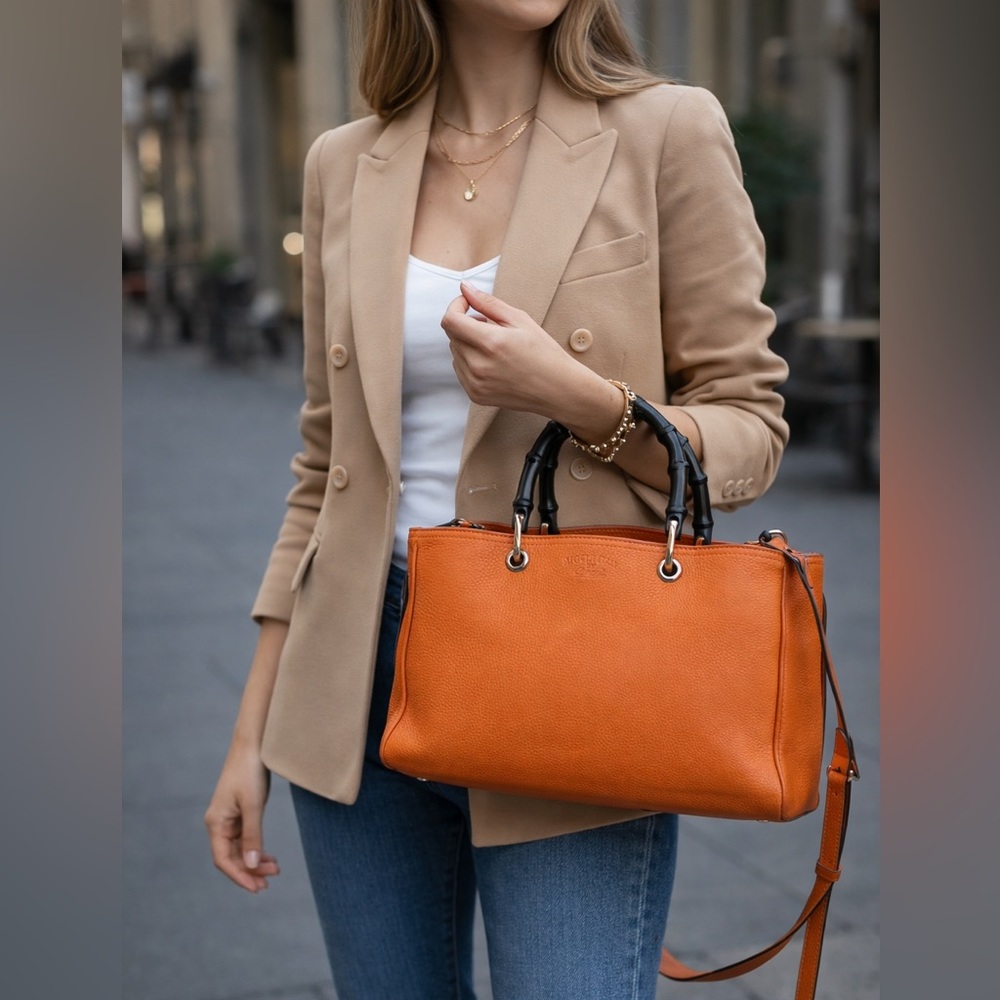 Gucci authentic satchel bag orange leather black bamboo handles with a strap